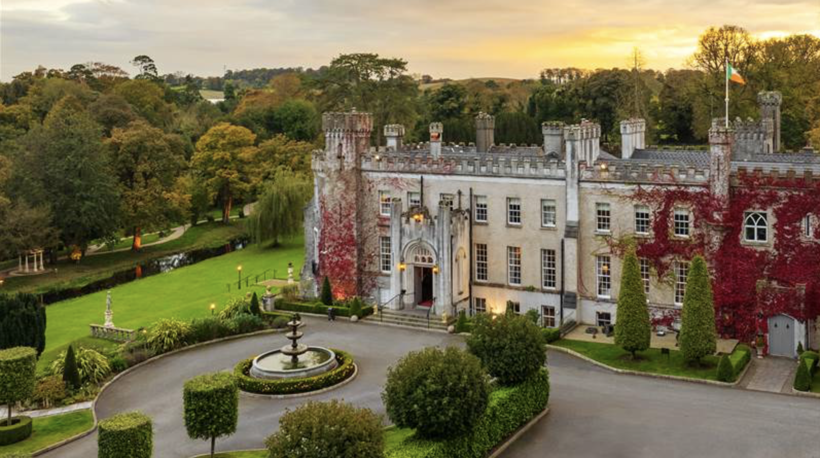 Aerial view of Bellingham Castle and its walled gardens beside the river